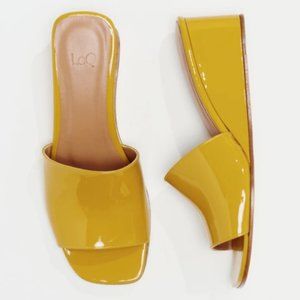 LOQ Sol Patent Leather Wedge Sandals in Yellow